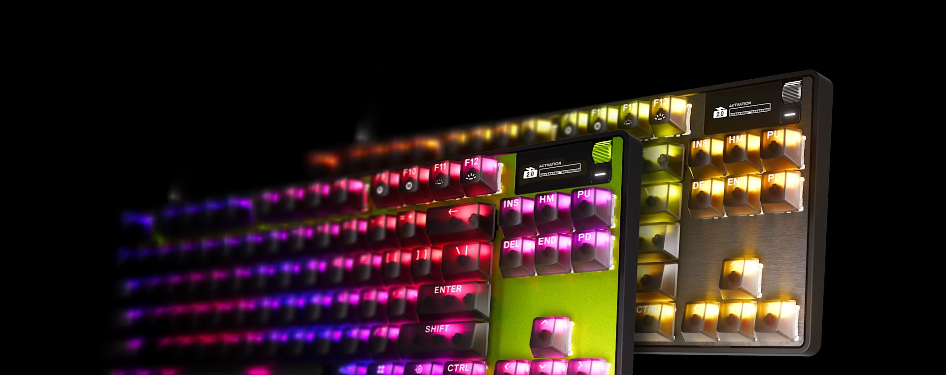 Close-up of the Apex Pro TKL Gen 3 gaming keyboard featuring pink RGB keycaps, a yellow top plate, an OLED smart display, and floating feature tags for Protection Mode, Rapid Trigger, and Rapid Tap.