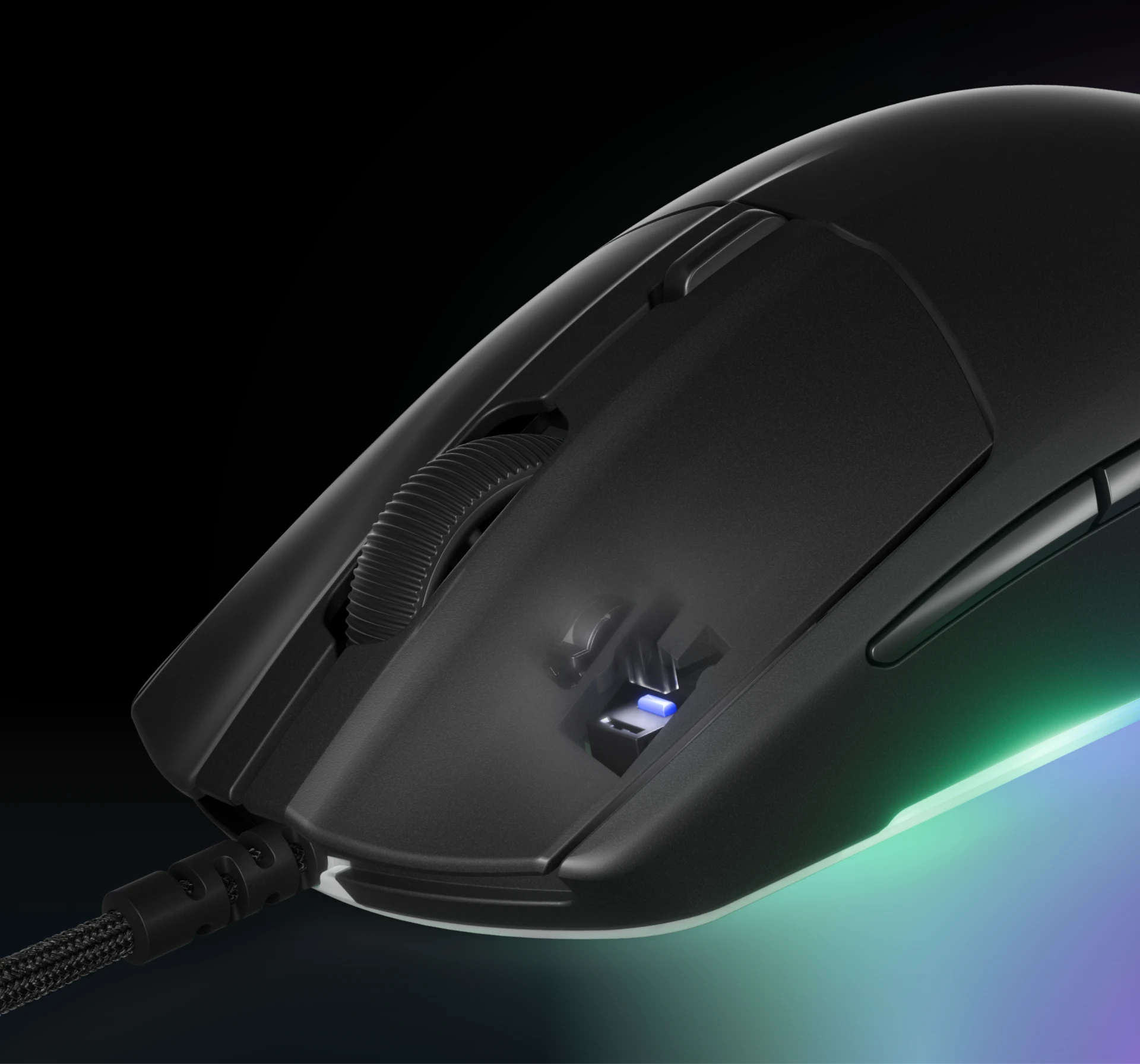The Rival 3 Gen 2 mouse is connected by a cable and has a glowing bottom with RGB colors.