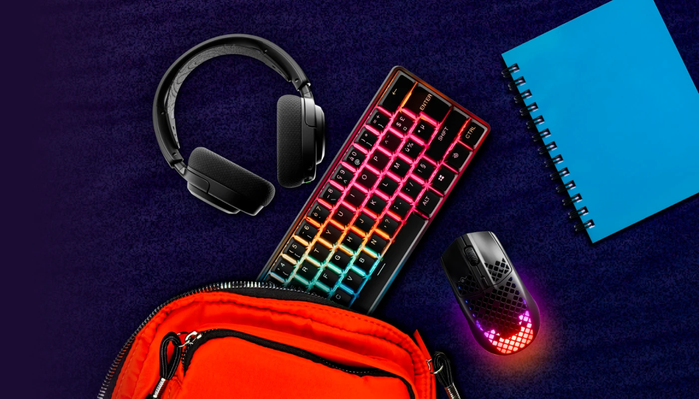 An image of assorted SteelSeries gear pictured with a backpack and notebook.