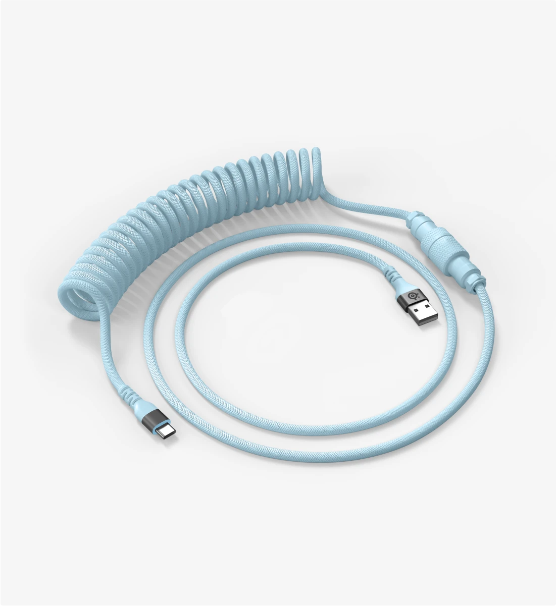 A close-up of a light-blue coiled keyboard cable with a USB-C connector on a plain white background.