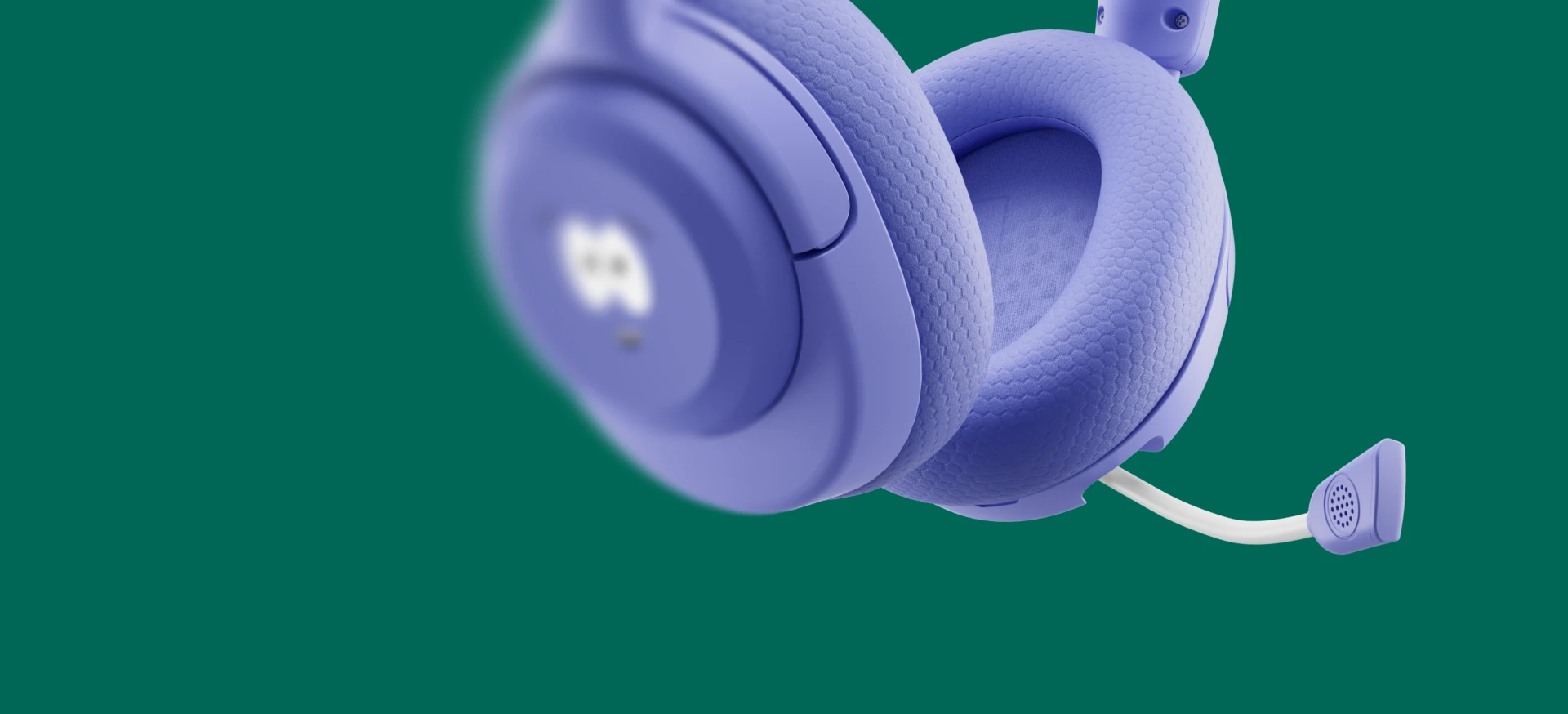 Close-up of the plush fabric ear cushion and retractable microphone of the purple Arctis Nova 5 Wireless South Park special edition gaming headset.