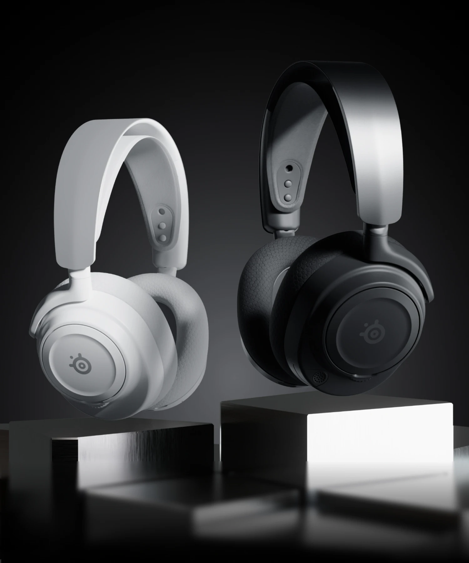 headphones in two colors, white and black, set against a dark background