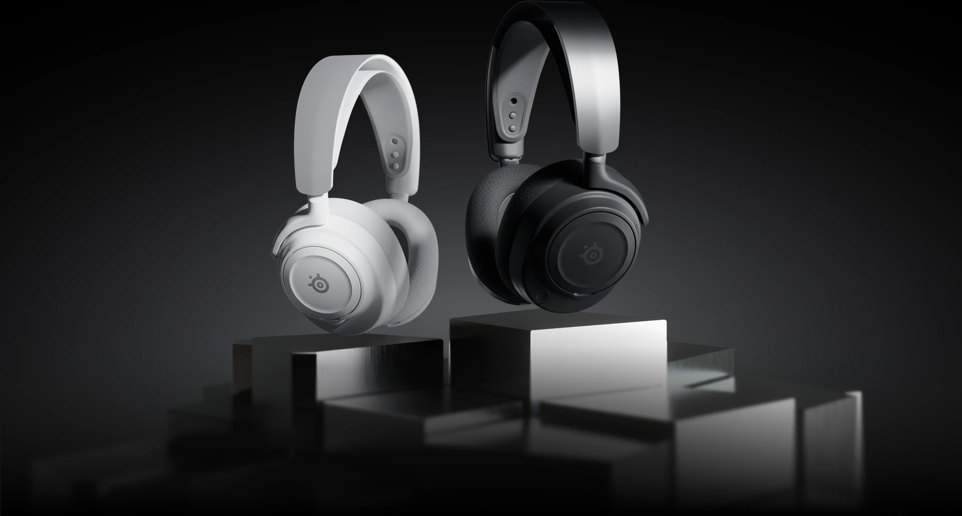 headphones in two colors, white and black, set against a dark background