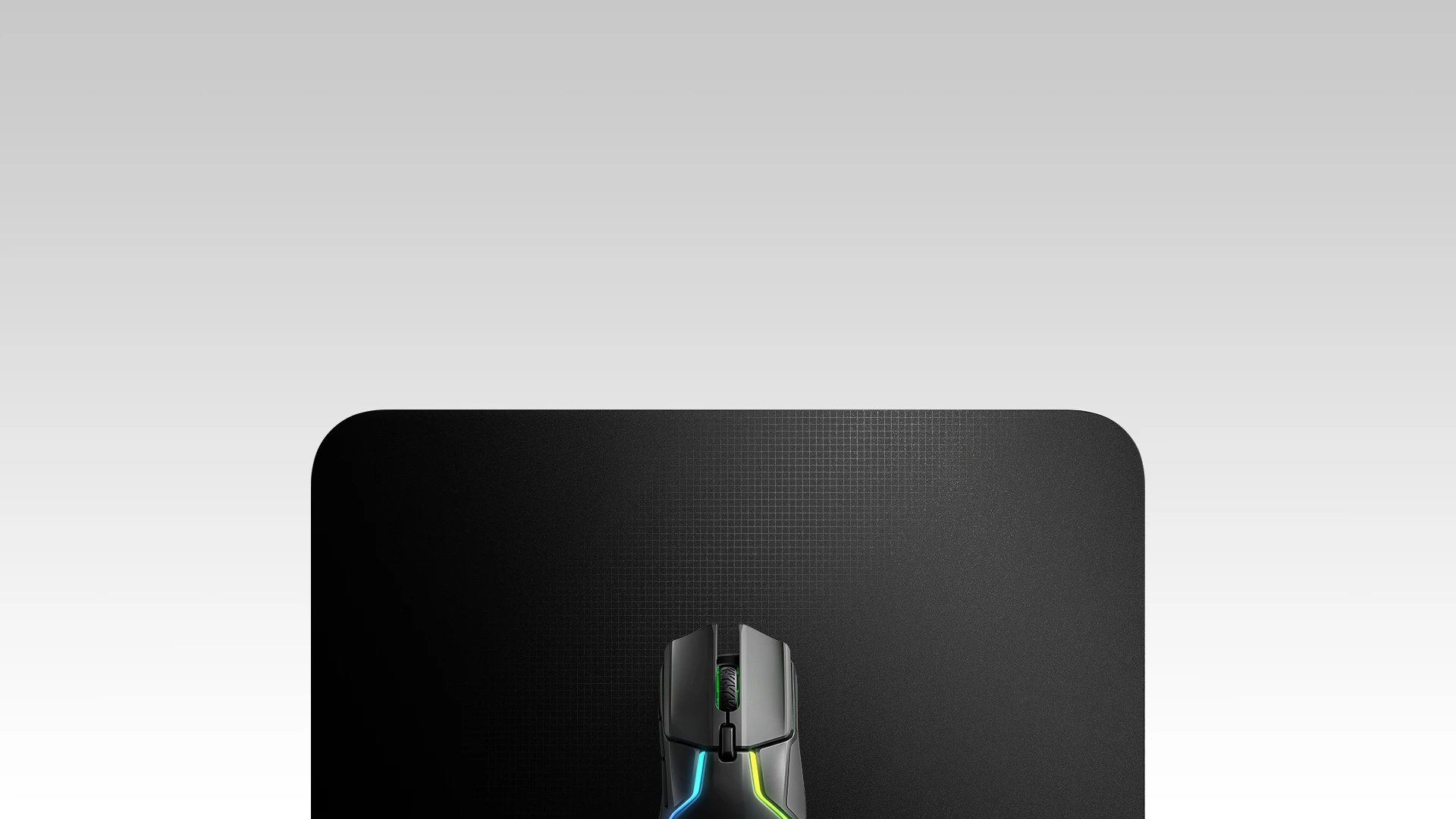 QcK Heavy mousepad with the mouse on it, top view