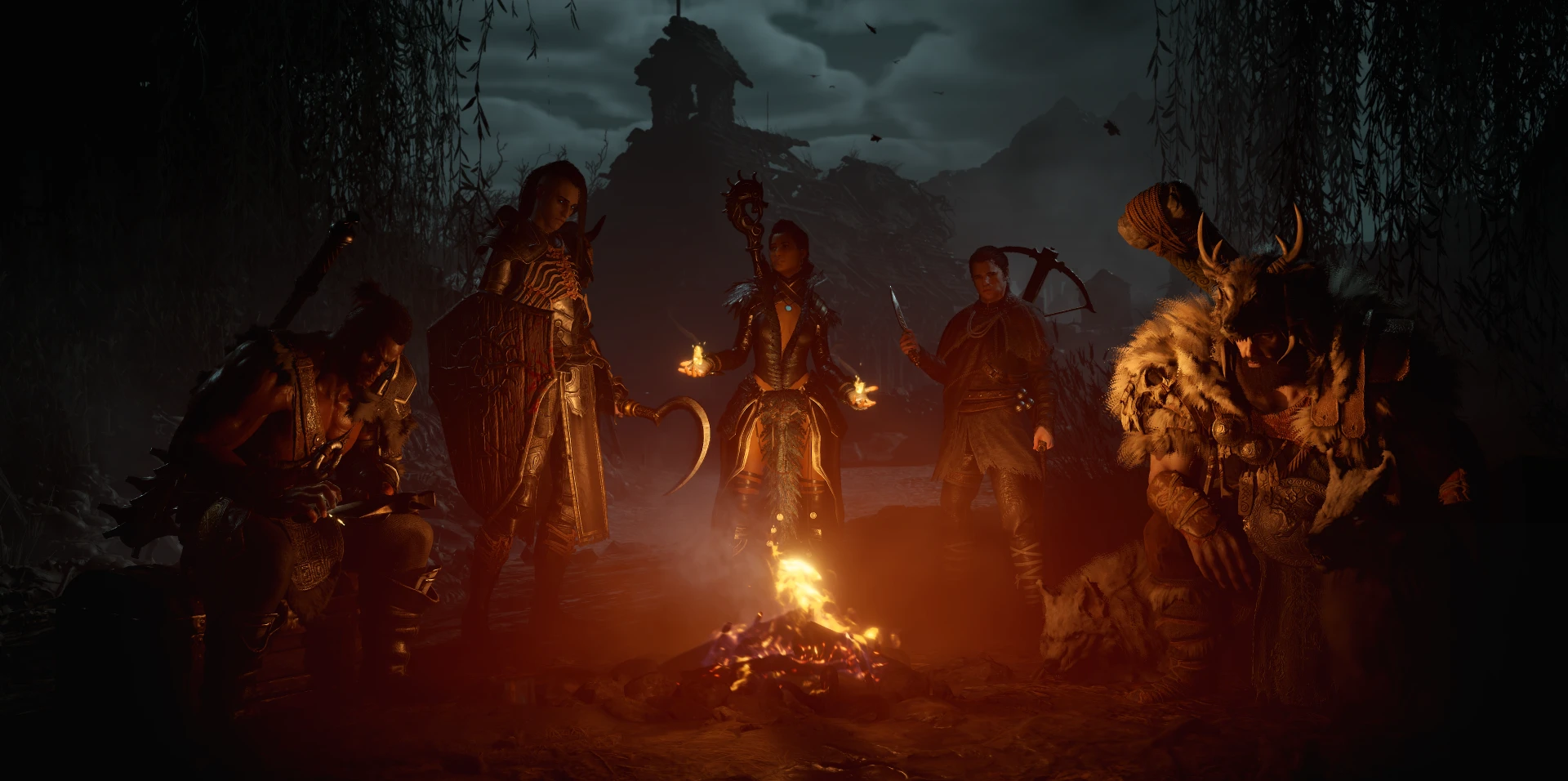 Pantalla de inicio de Diablo IV; todos los personajes disponibles junto a la hoguera.