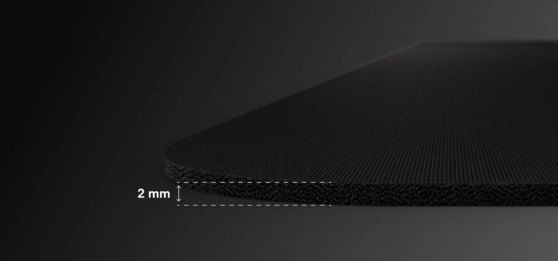 Qck black mouse pads with 2mm metric visible on the edge.