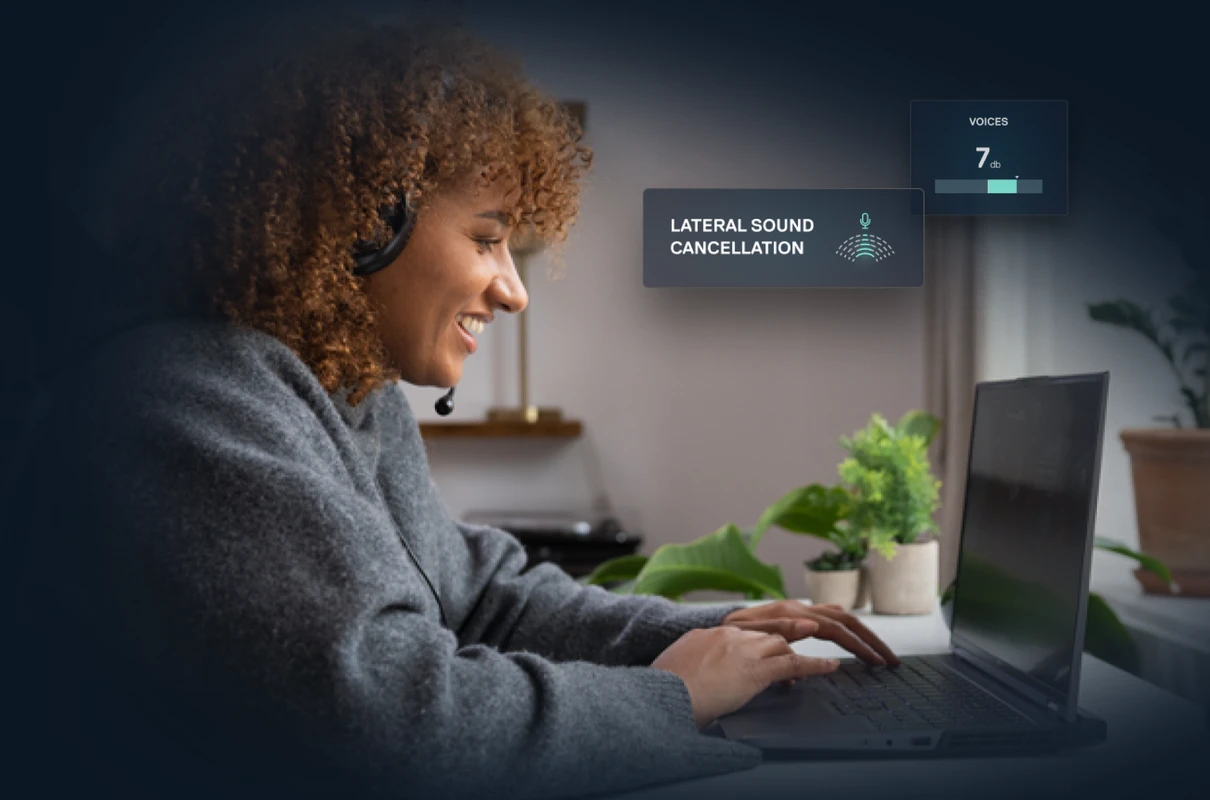 A smiling woman wearing a headset uses a laptop. An overlay highlights "LATERAL SOUND CANCELLATION," demonstrating a feature for clear audio calls.