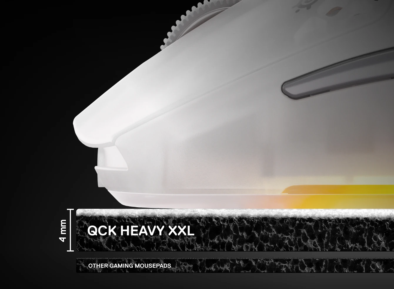 A close-up side view showing the 4mm thickness of the SteelSeries QcK Heavy XXL mousepad compared to thinner standard pads, with a white gaming mouse resting on top.