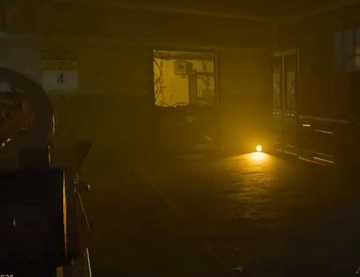 A dark room filled with moisture with bright yellow light in the corner pointed into to viewer of the image.