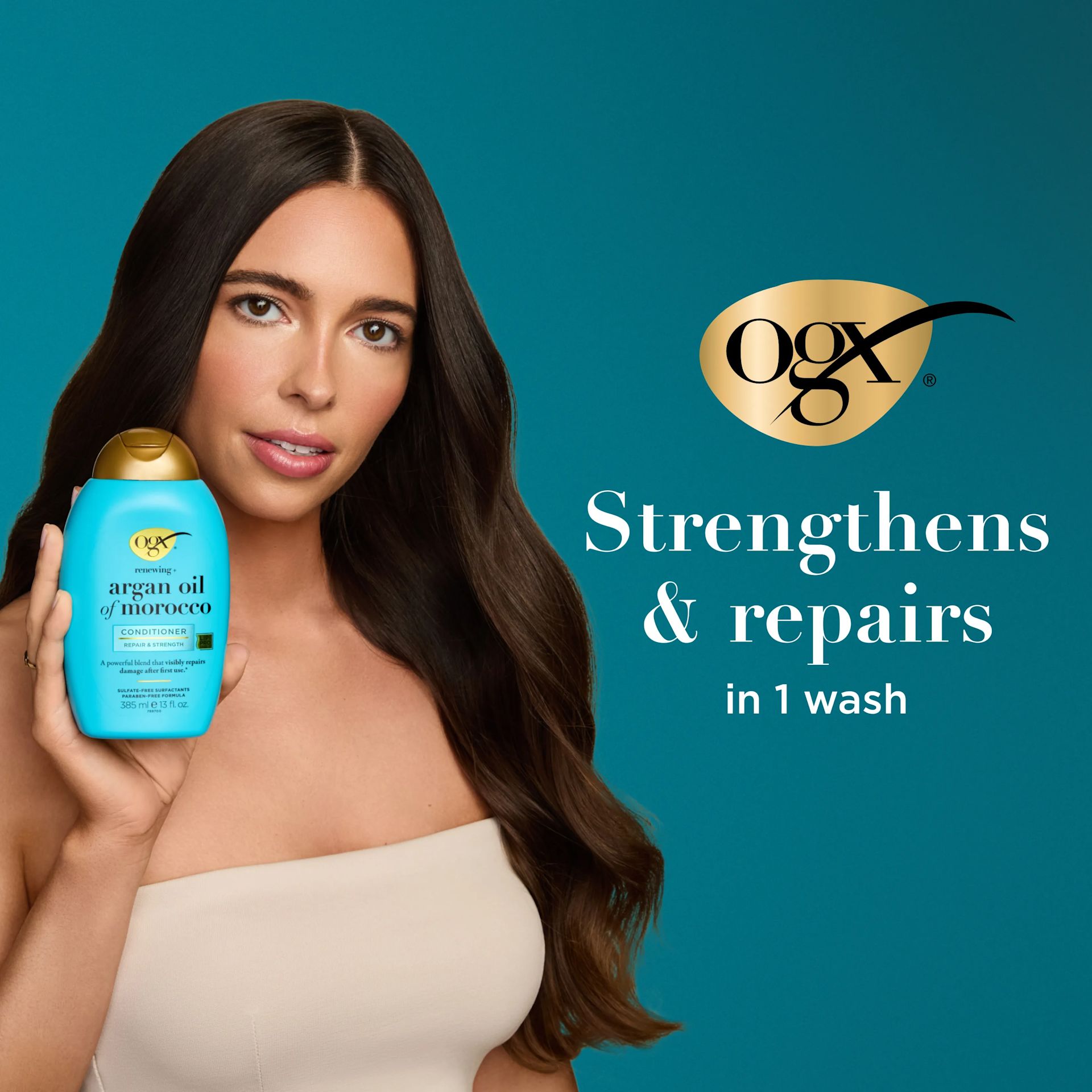 Woman holding Argan Oil of Morocco Conditioner. Strengthens and Repairs in 1 wash