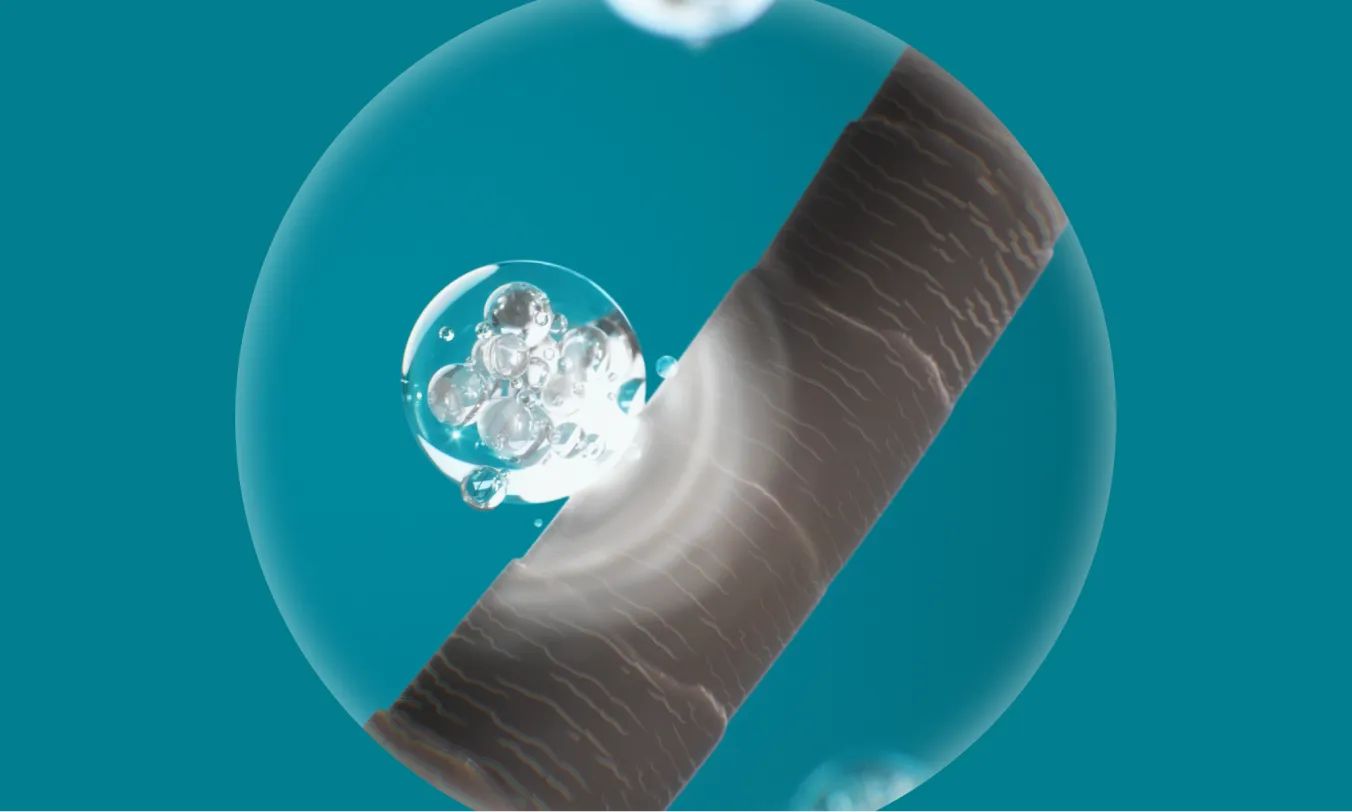 Closeup Image of Peptides being applied to hair follicle roots