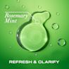OGX® Rosemary Mint Extra Strength Shampoo product smear on a green background