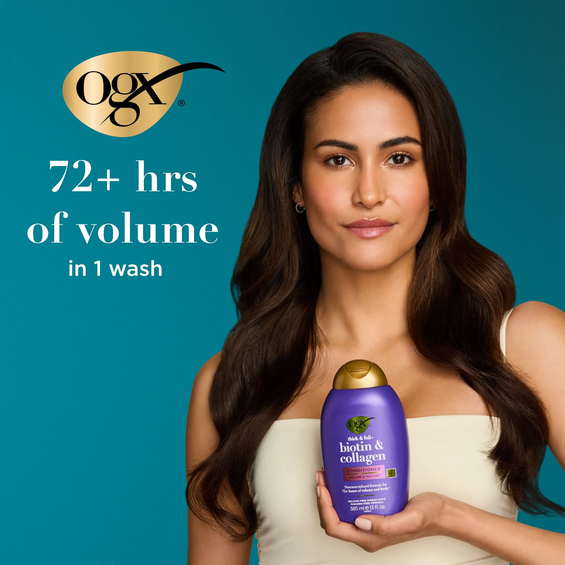 Woman holding Biotin & Collagen Conditioner. 72+ hrs of volume in 1 wash