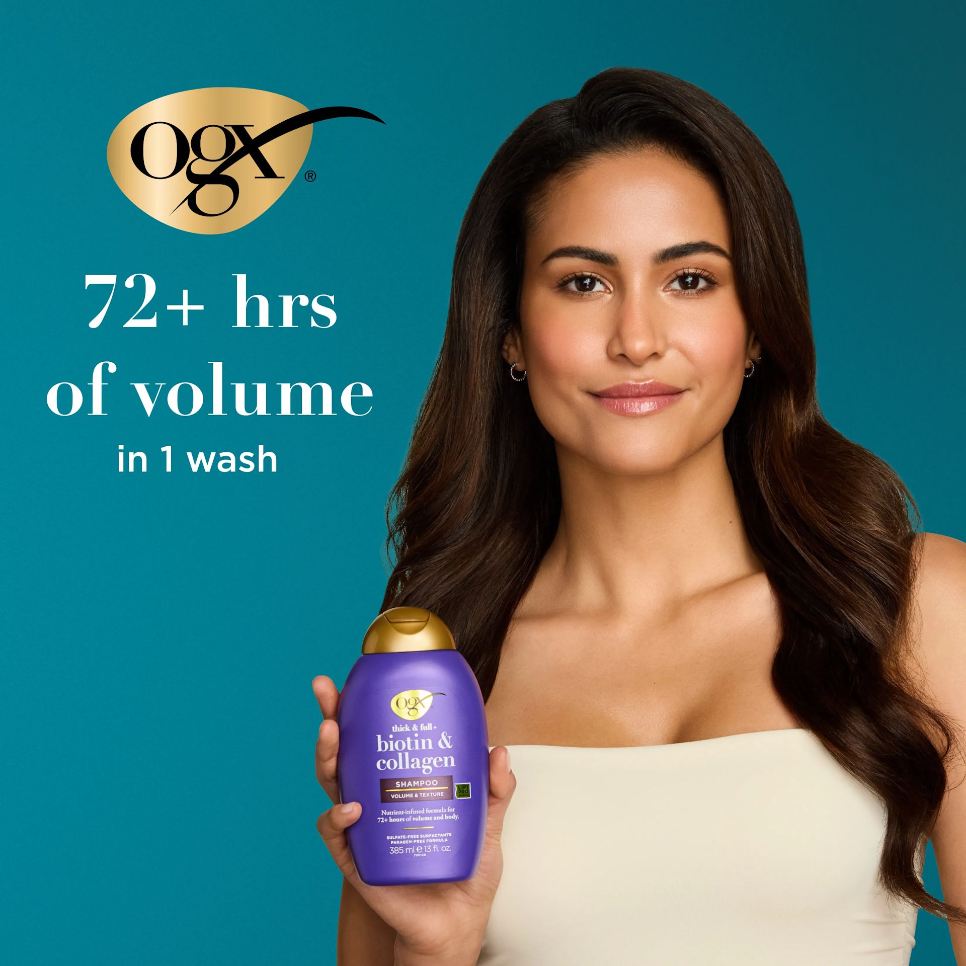 Woman holding Biotin & Collagen Shampoo. 72+ hrs of volume in 1 wash