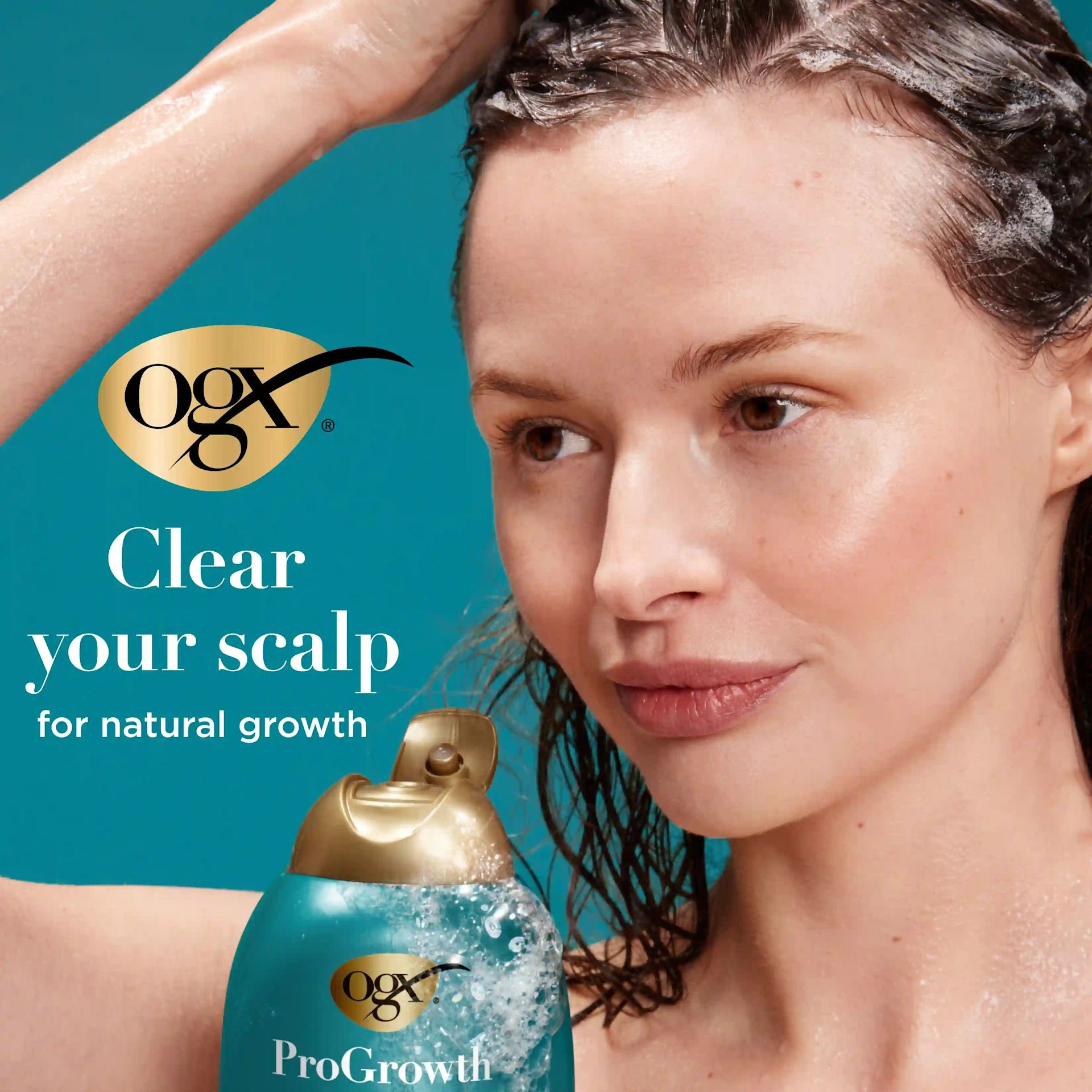 Woman washing hair with ProGrowth + Peptide Shampoo. Clear your scalp for natural growth