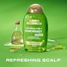 Front shot of OGX® Rosemary Mint Shampoo, 385 mL with lab tubes