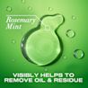 OGX® Rosemary Mint Extra Strength Shampoo product smear on a green background