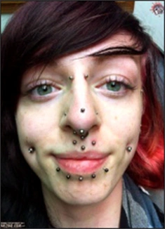 Image: Multiple facial piercings.