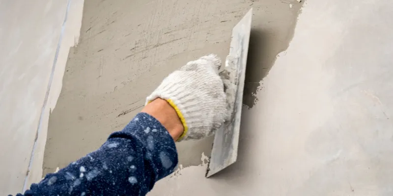 How to Render a Wall: A Beginner’s Guide Article Image An external wall being rendered by a professional.