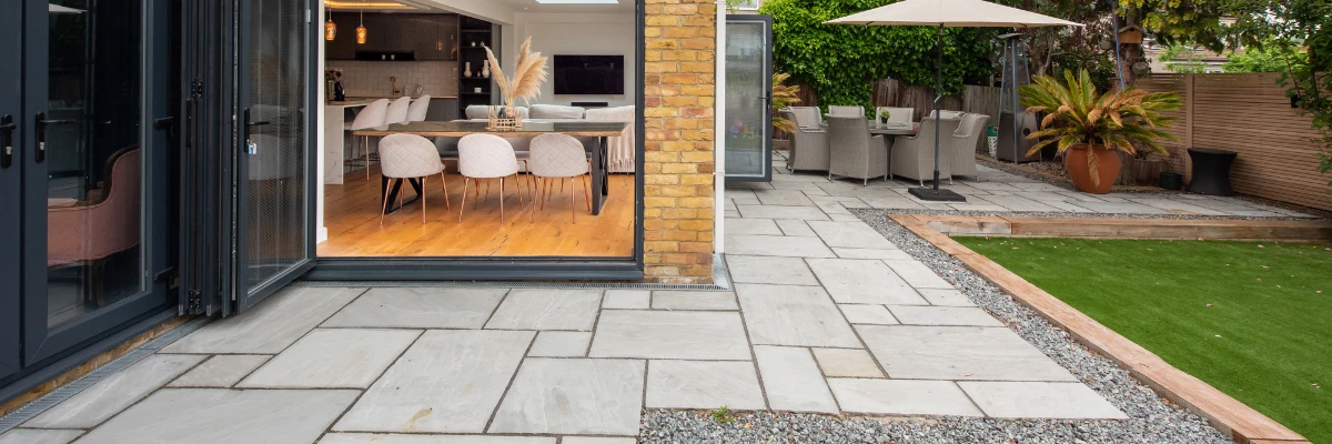 A stylish, modern patio running alongside a home.