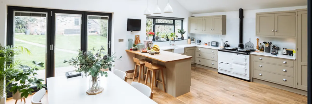 A modern kitchen and dining room with bifold doors.