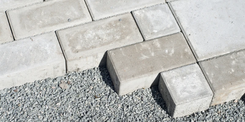 How to Lay a Patio Without Cement: Alternatives Explained Article Image 2 Bricks and paving slabs laid on top of an aggregate foundation.