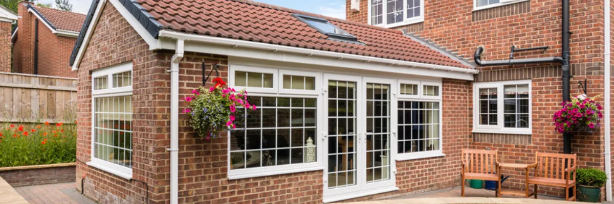 A conservatory with a tiled roof.