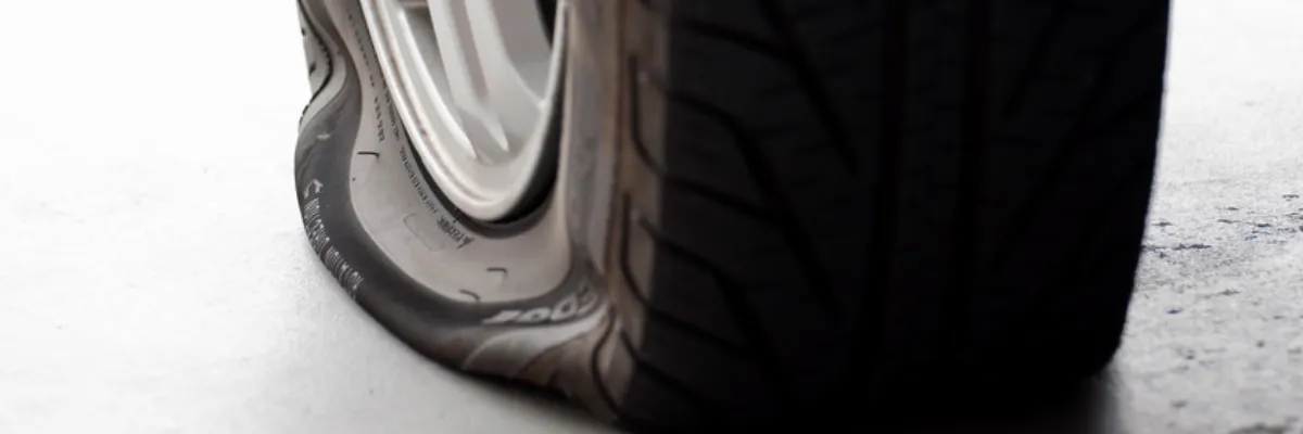 A deflated, punctured tyre.