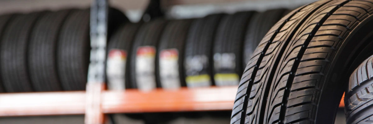 A close-up shot of a rack of new tyres.