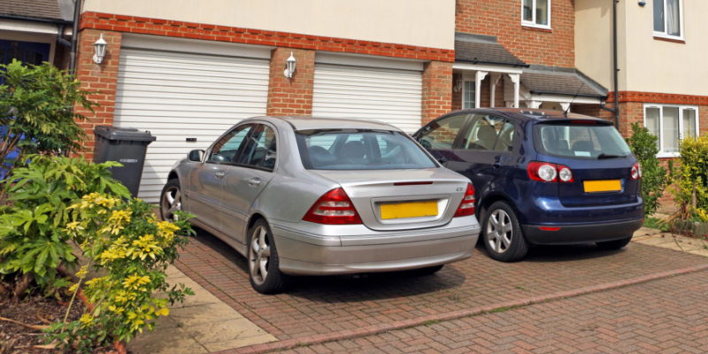 Block Paved Driveway Article Image A block-paved driveway with two cars parked on it.