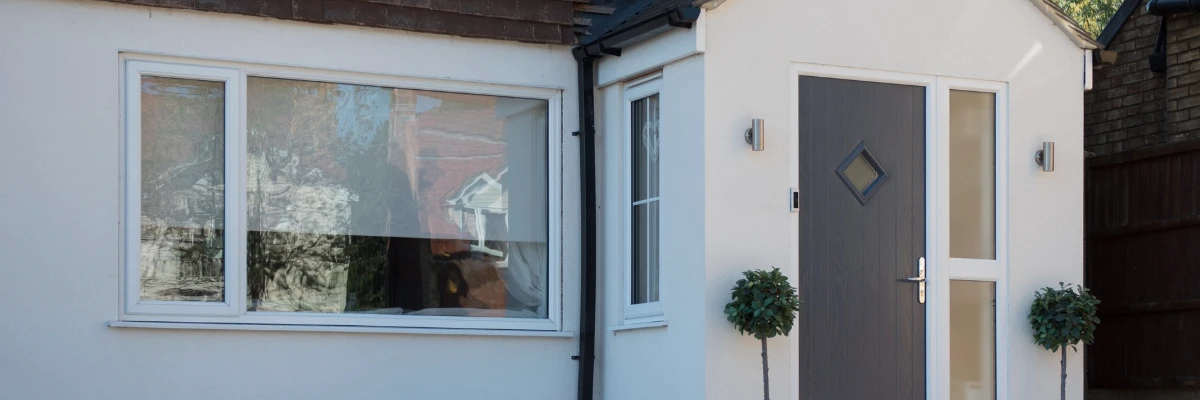 A modern home's double glazing uPVC window installation, as seen from the front of the house. 