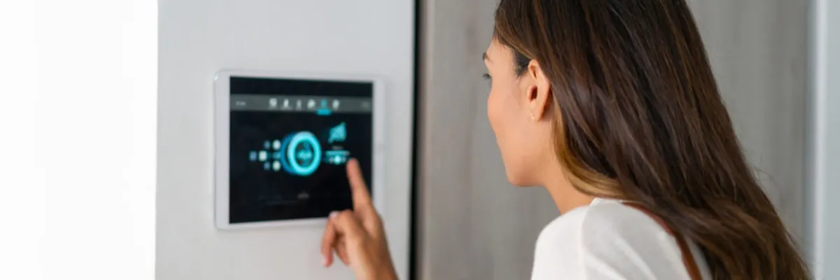 A woman setting her security system up.