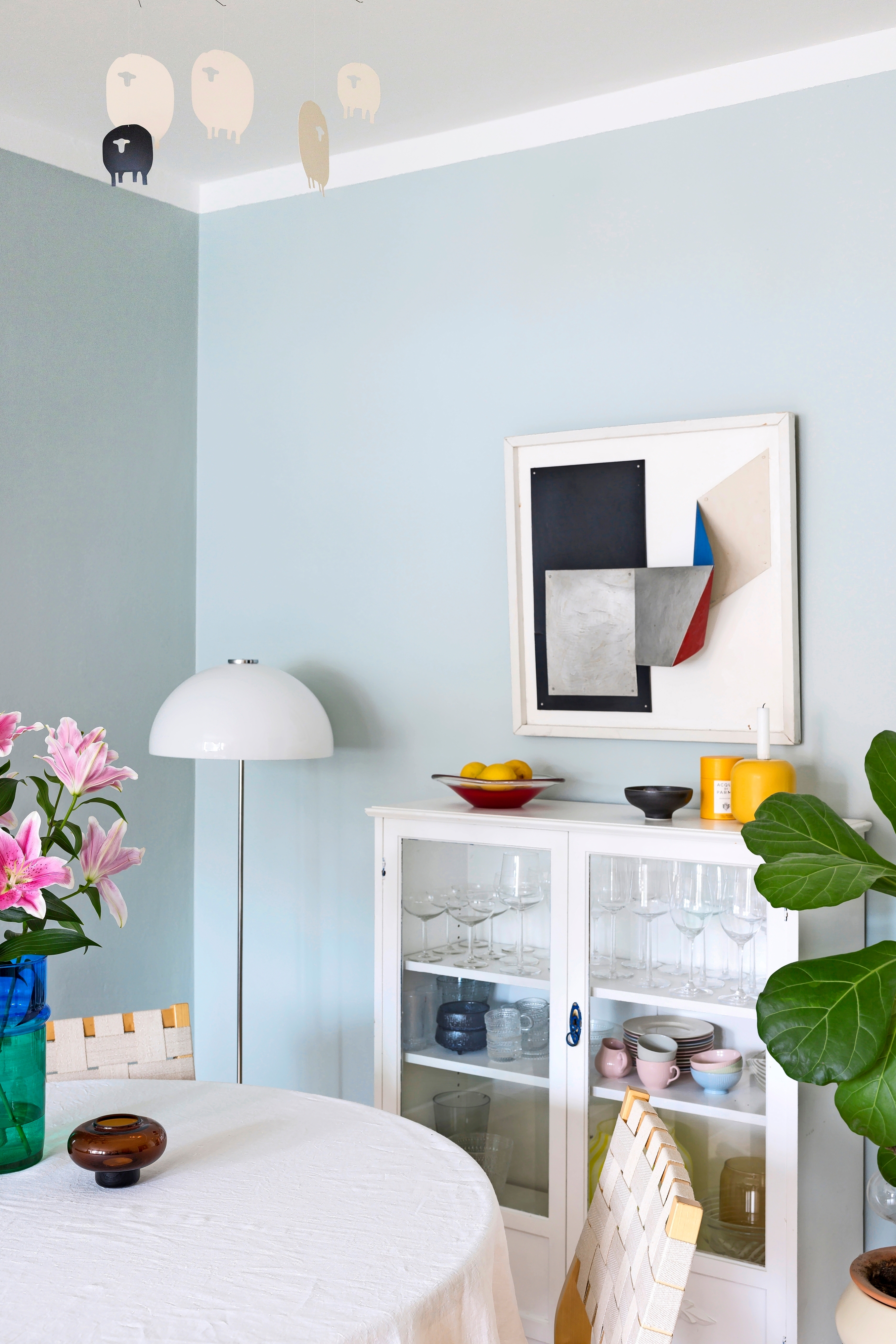 An old white sideboard in the dining area of the living room