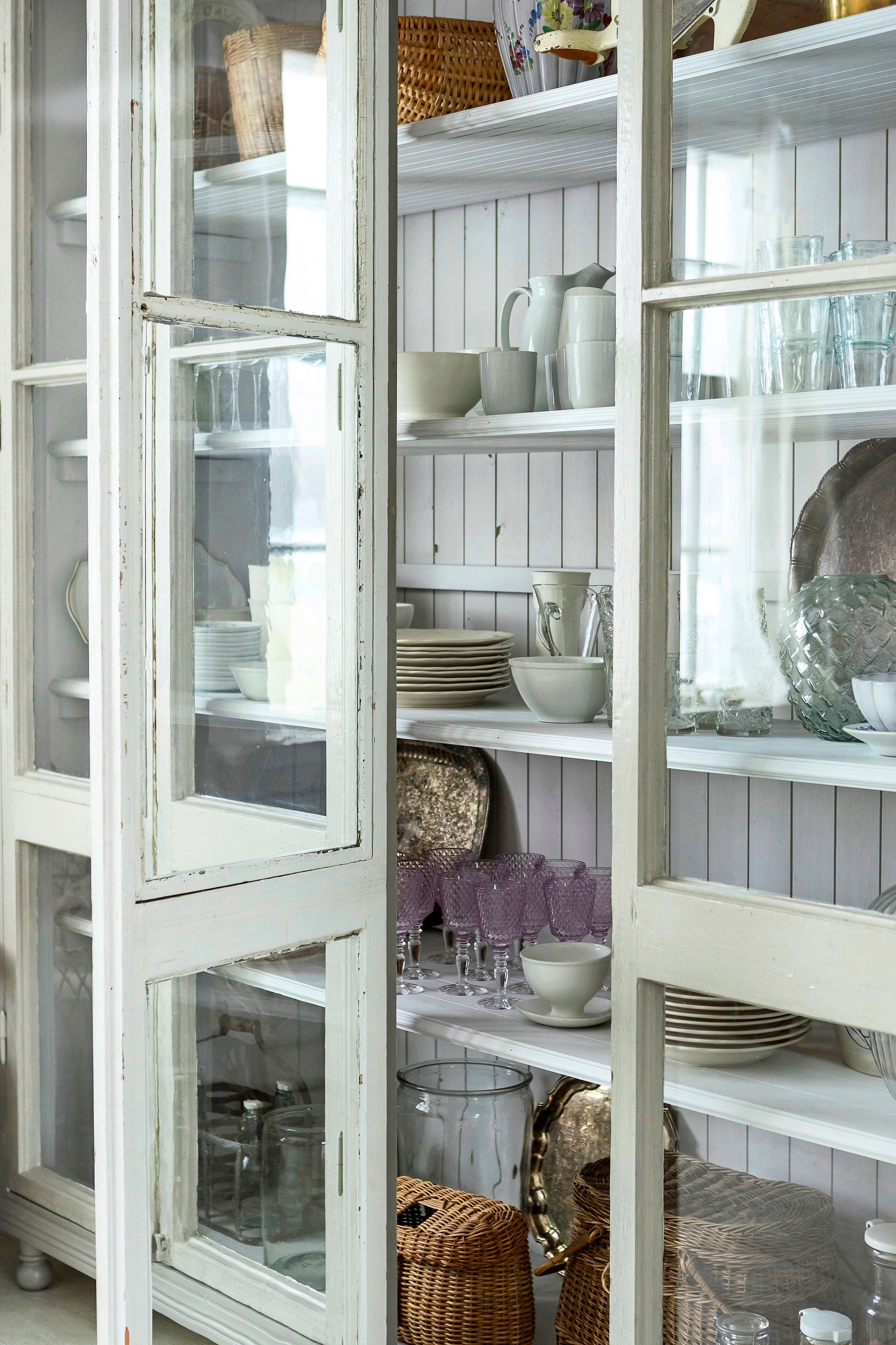 A display cabinet made from old elementary school windows
