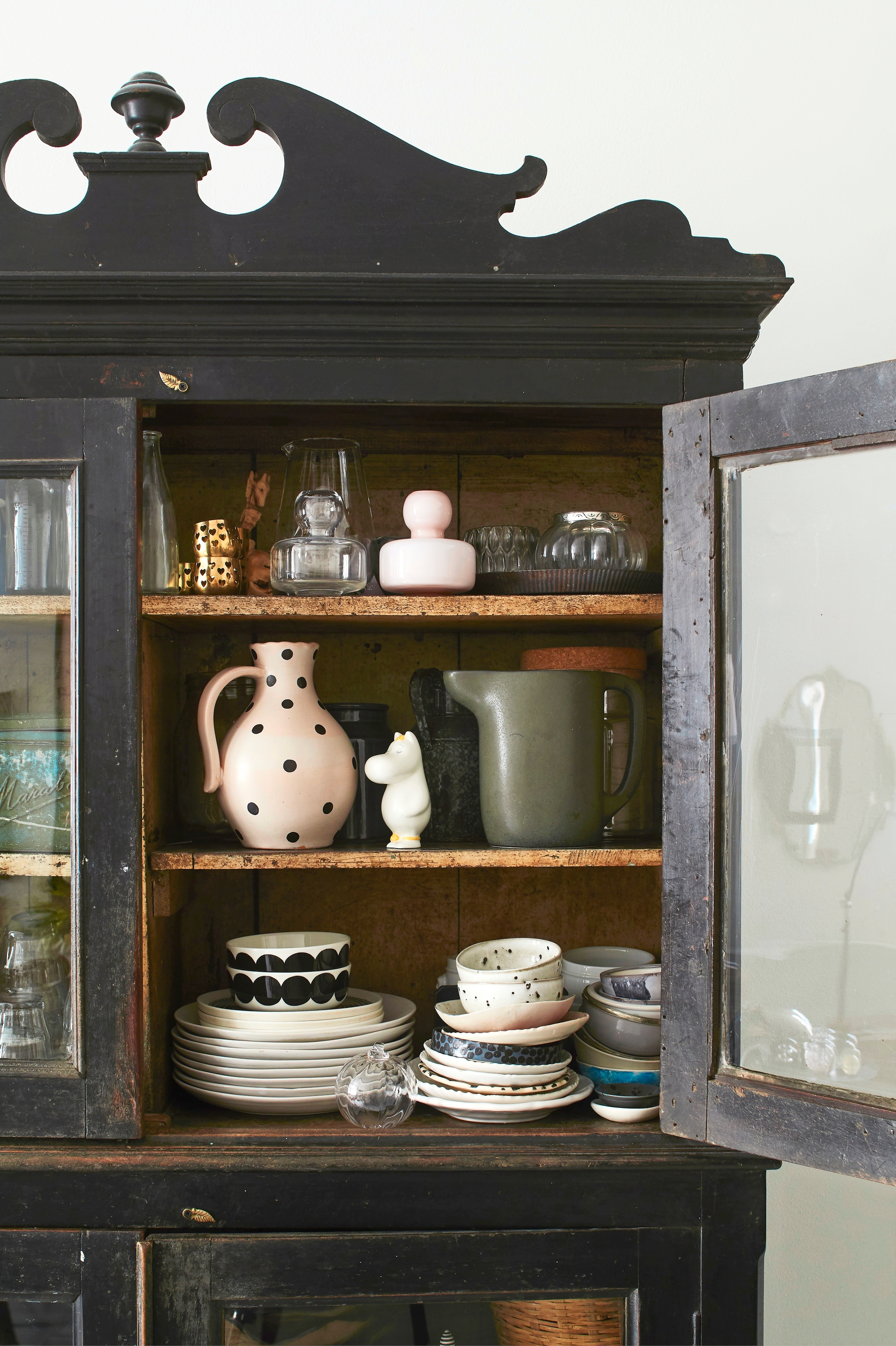 A sturdy Indian vintage dish cabinet