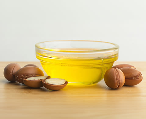 An argan oil extracted from the seed in the bowl