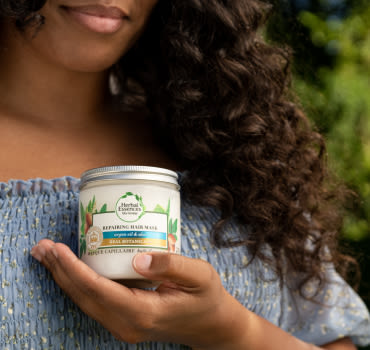 Red Haired woman with her hand in her hair