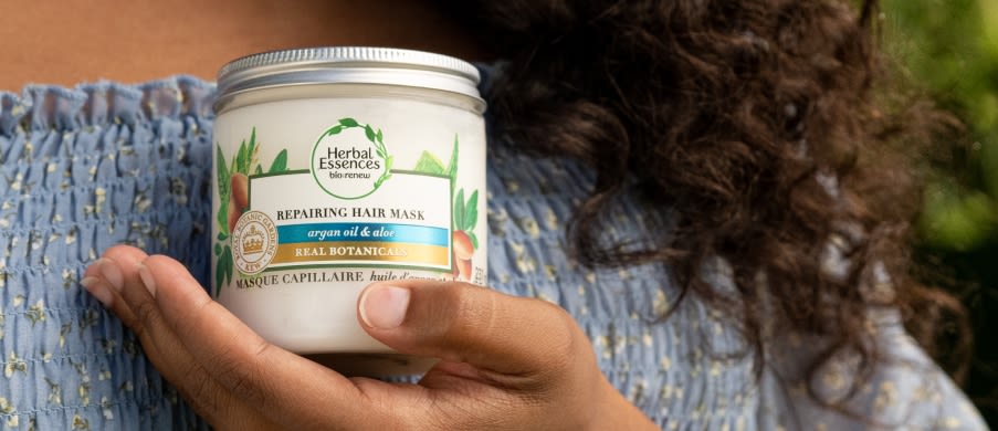 Red Haired woman with her hand in her hair