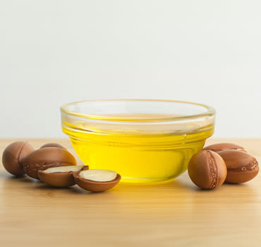 An argan oil extracted from the seed in the bowl