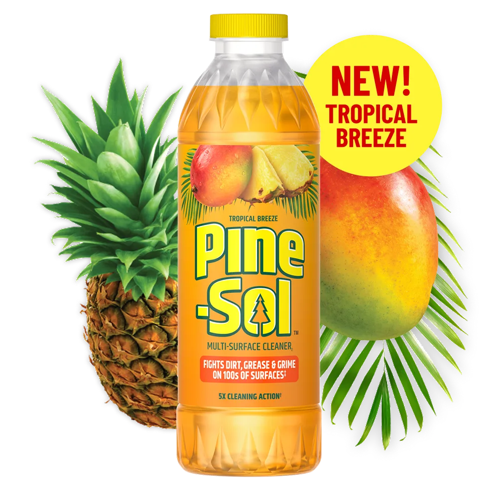 Botella del limpiador Brisa Tropical con mango y piña al fondo