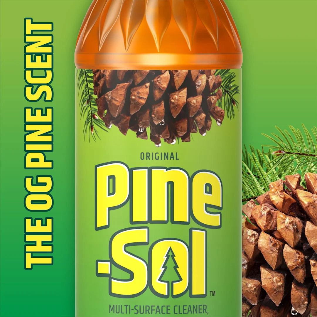 The words The OG Pine Scent on a green background with pine cones around the edges