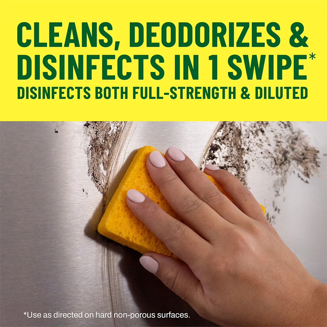 A hand using a sponge to clean a dirty wall with the words Cleans, Deodorizes & Disinfects in 1 Swipe in a yellow banner
