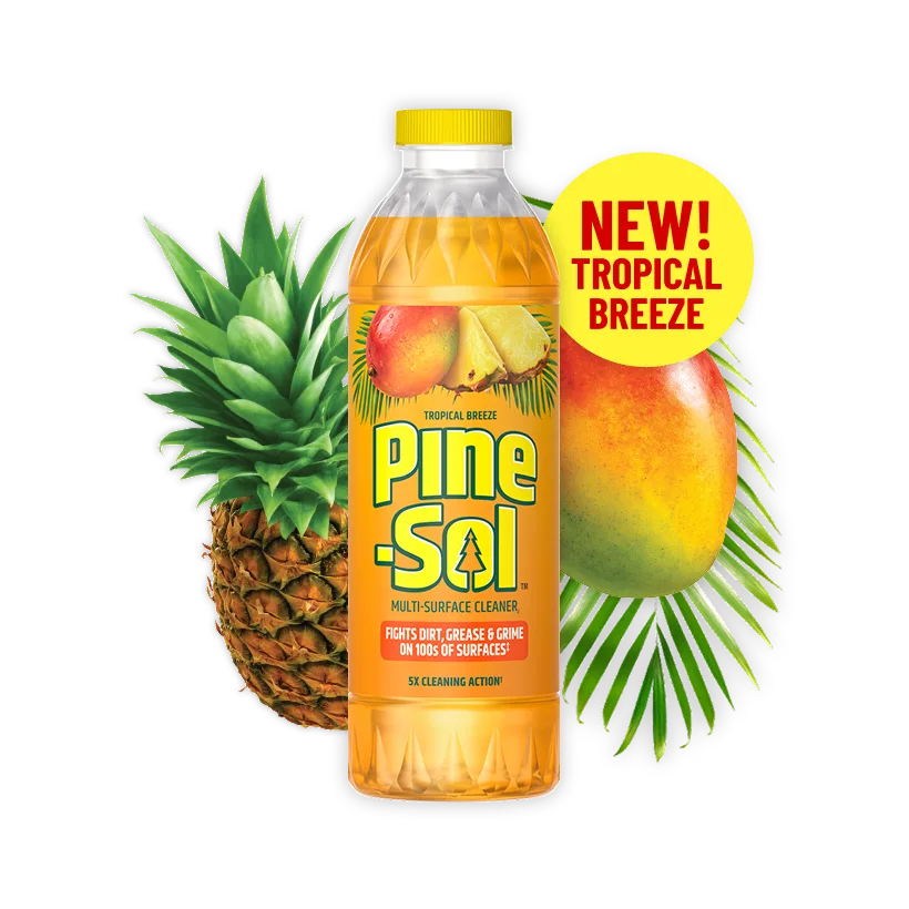 Botella del limpiador Brisa Tropical con mango y piña al fondo