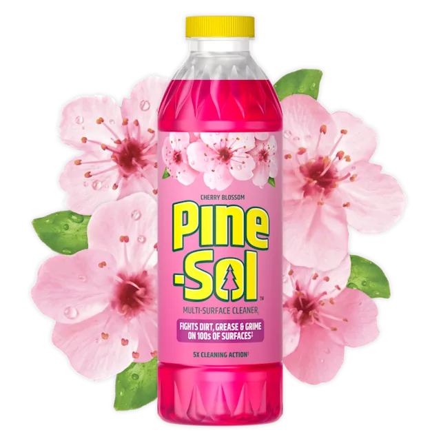 Bottle of Pine-Sol Cherry Blossom cleaner with cherry blossoms in background