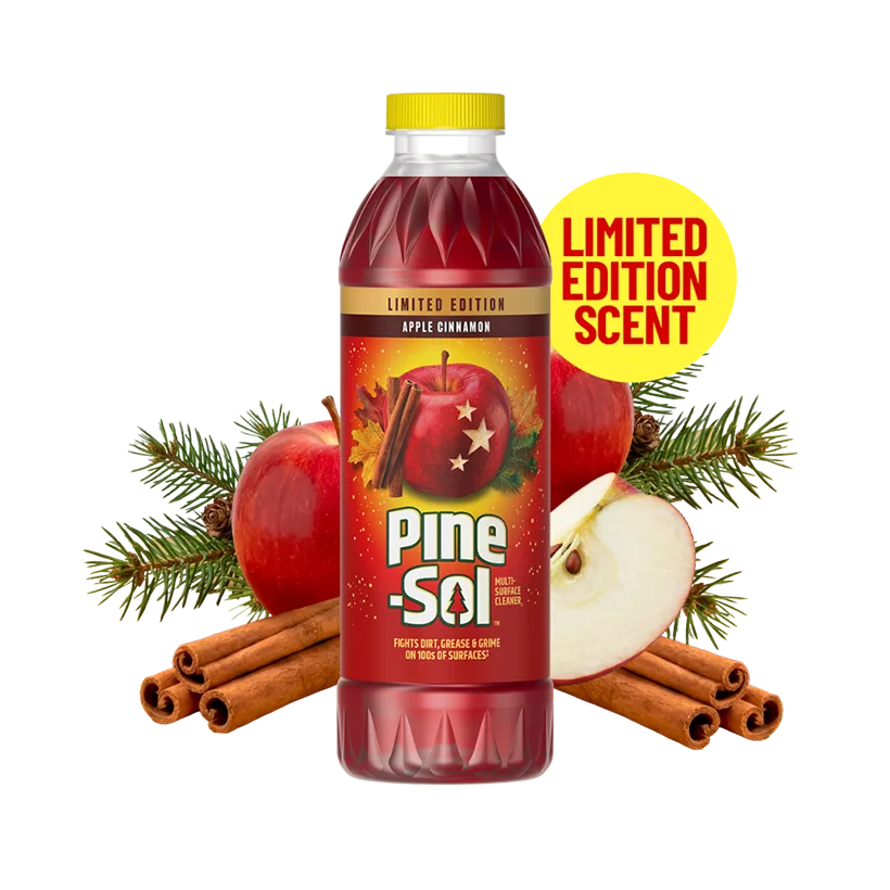 Pine-Sol Apple Cinnamon Multi-Surface Cleaner bottle with yellow cap, surrounded by red apples, cinnamon sticks and pine for a warm fall-inspired clean.