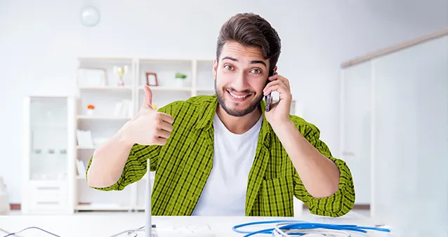 man-on-phone-router-on-table