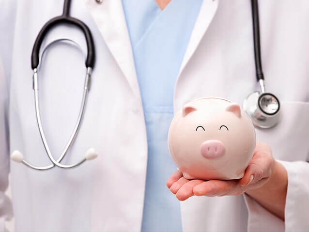 medical-specialist-with-piggy-bank-in-hand