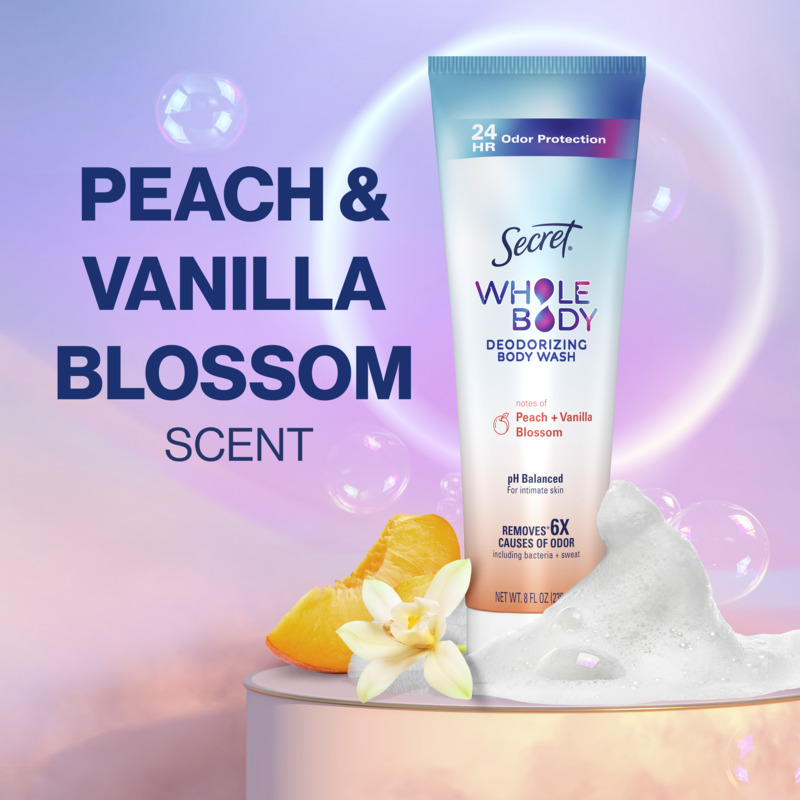 Secret Whole Body Deodorizing Body Wash in Peach and Vanilla Blossom scent with bubbles and flowers in the backgroun