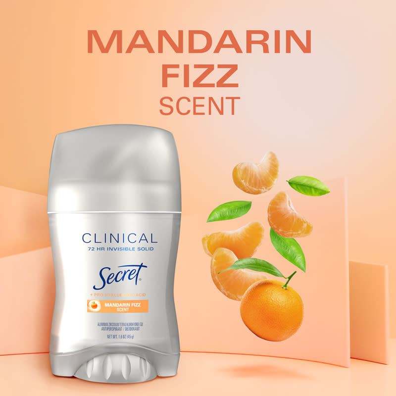 Secret Clinical Invisible Solid Mandarin Fizz deodorant stick with vibrant citrus fruits in the background