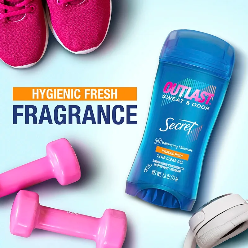 A bottle of body lotion and dumbbells